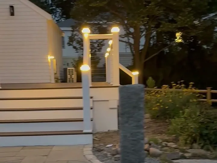 Outdoor deck step and post lighting at dusk