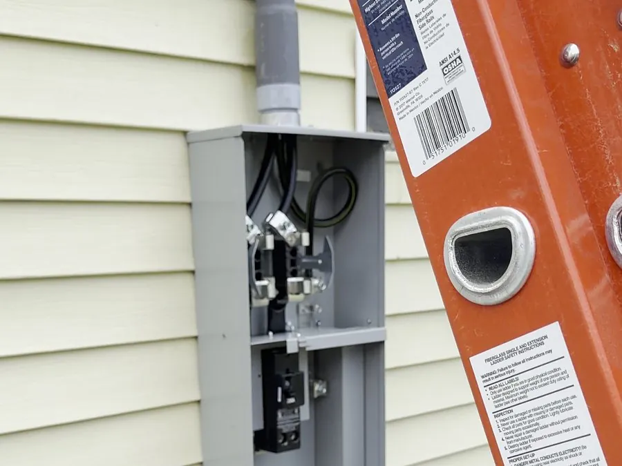 Electrical service upgrade in progress with new meter socket wiring