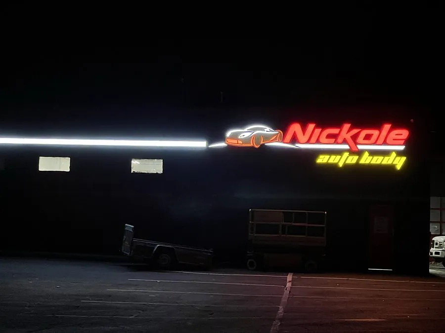 Commercial LED building sign lit up at night