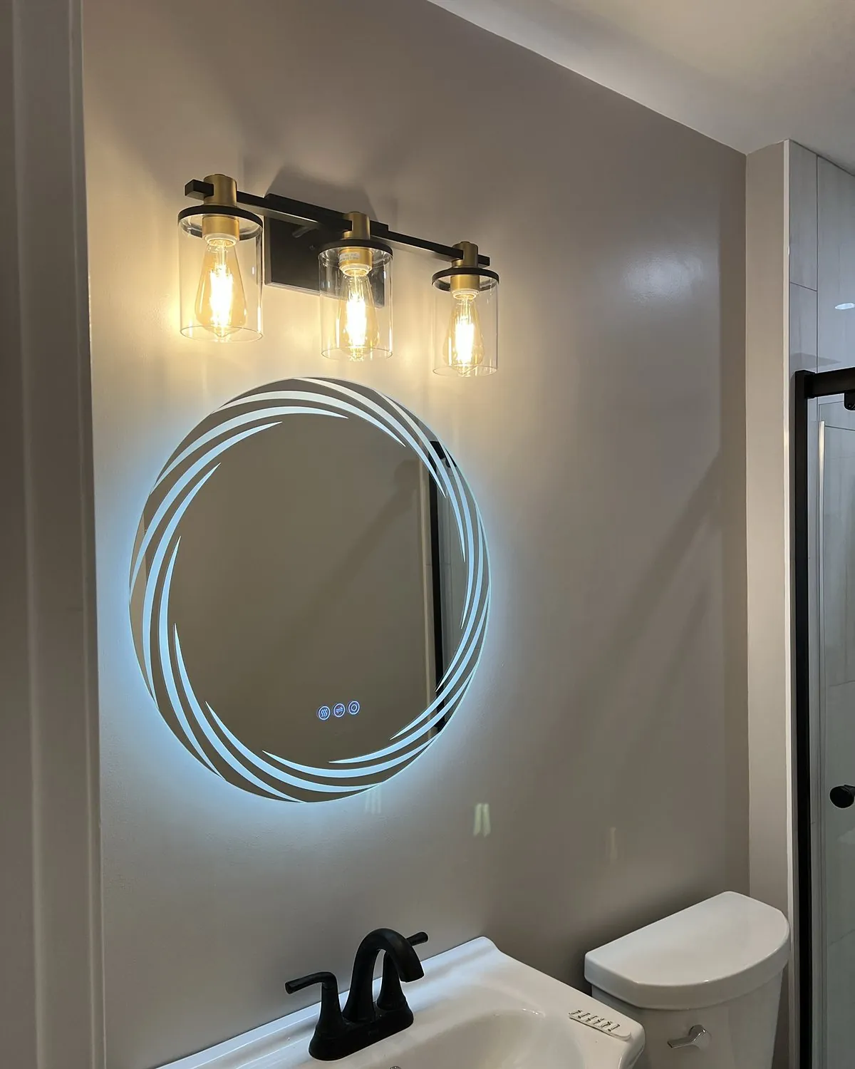 Bathroom vanity light fixture and backlit LED mirror installation